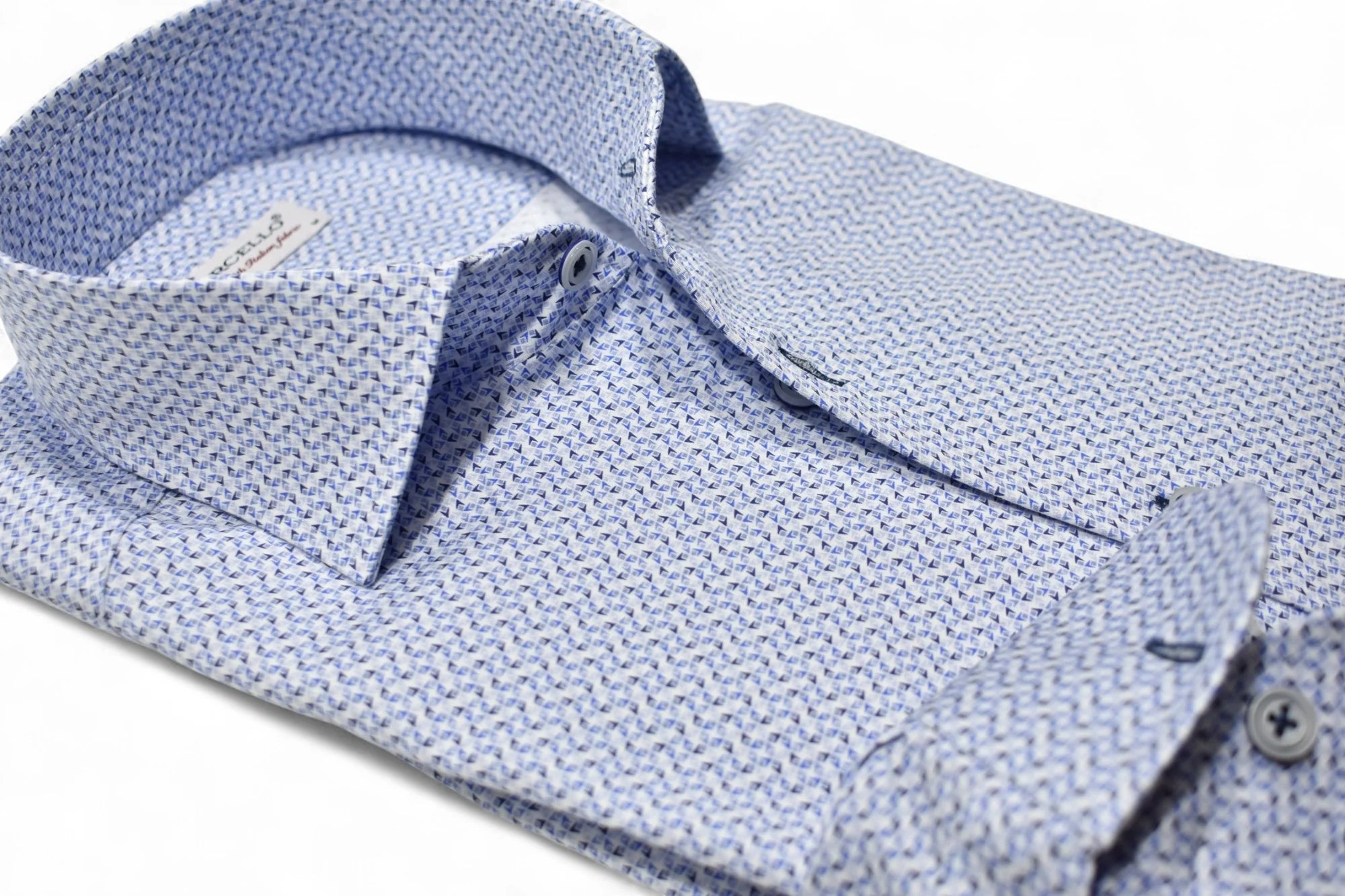 Close-up of a blue textured shirt with collar and button details on a white background