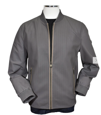 The Marcello Chevron Leather Jacket J-228 features a gray zip-up design with a subtle herringbone pattern, ribbed cuffs, and two zippered side pockets, capturing Italian elegance as showcased on a mannequin.
