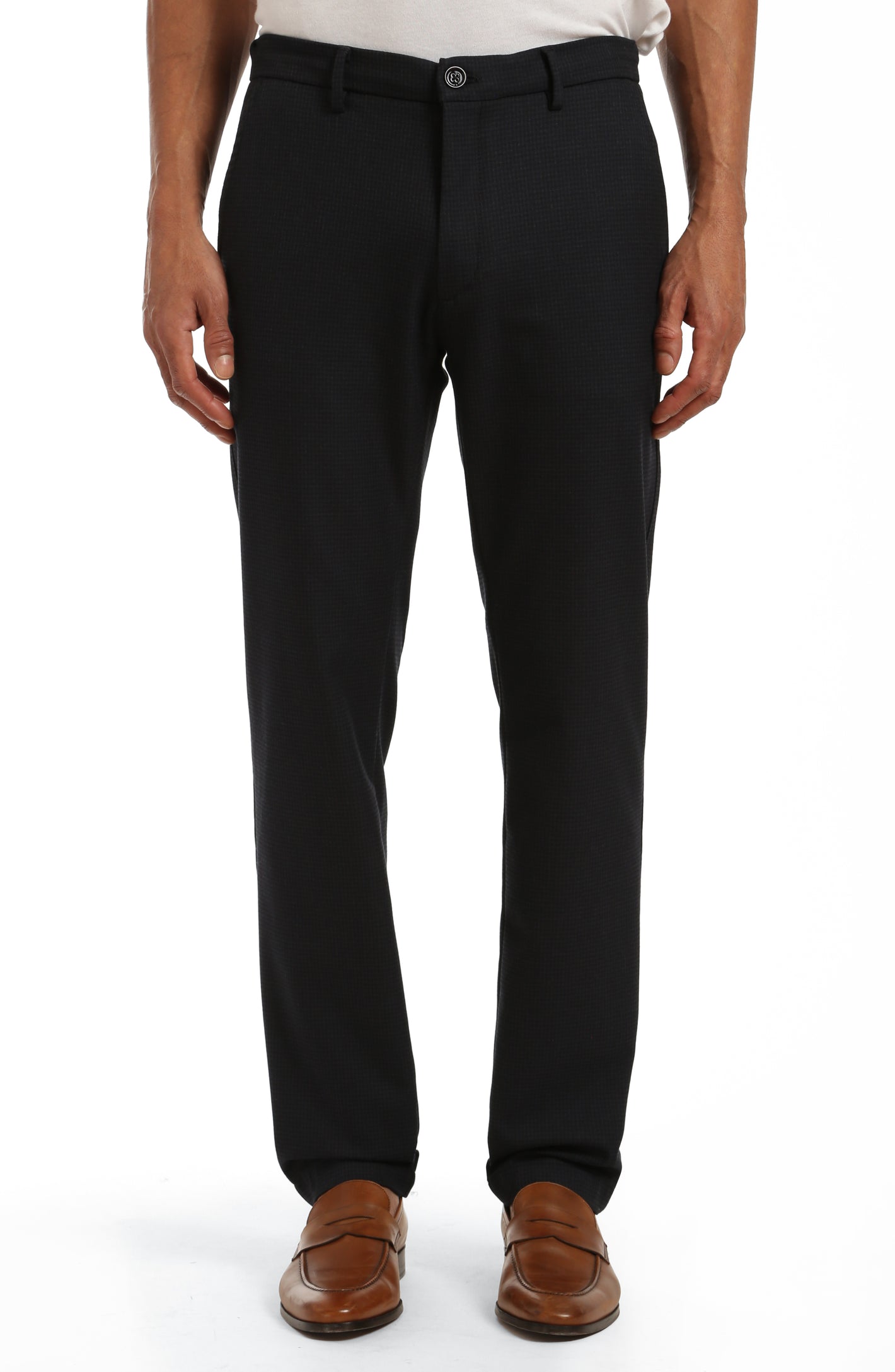 A person wearing 34 Heritage Seville Check Sporty pants by 34 Heritage and brown loafers, standing against a white background.