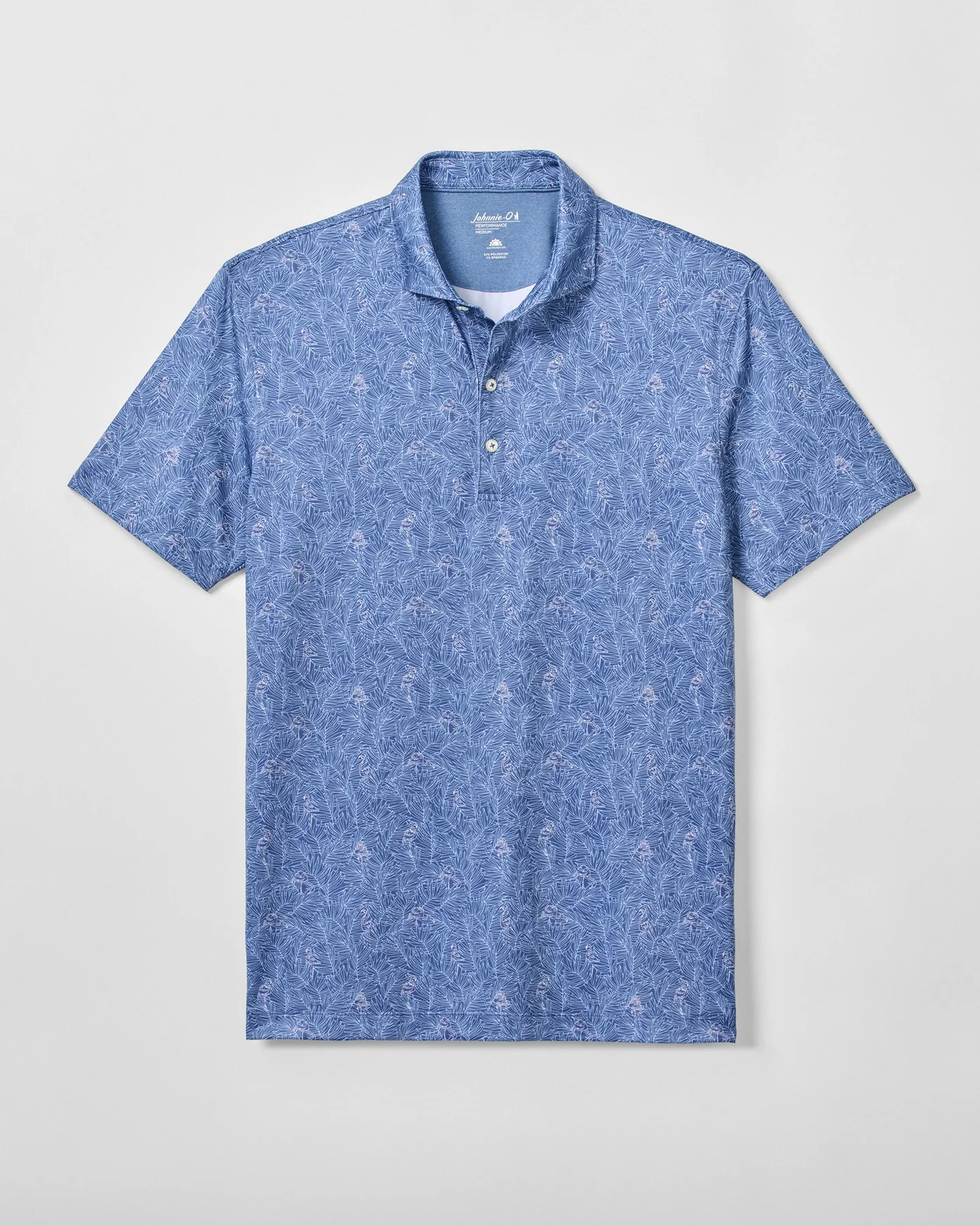 The Johnnie-O Osmond Big & Tall Polo by Johnnie-O is a blue short-sleeve performance shirt with a subtle white floral pattern, three-button front, and moisture-wicking fabric, shown laid flat on a light background.