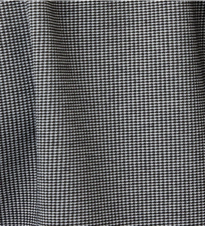 Close-up of the black and white houndstooth fabric with visible folds and texture on the Stone Rose SS Pique Shirt 2K7T241, showcasing its modern design.