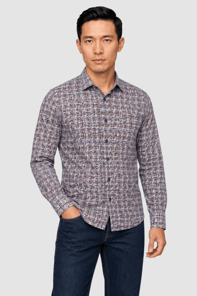 Man wearing the Garnet Vincent Tile Print Sport Shirt 2621032 and dark blue jeans, standing against a plain background with one hand in his pocket.