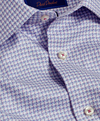 Close-up of the David Donahue Chk TBSP10809464 Pima cotton dress shirt featuring a blue and pink geometric pattern, spread collar, white buttons, barrel cuff, and visible David Donahue label inside the collar.