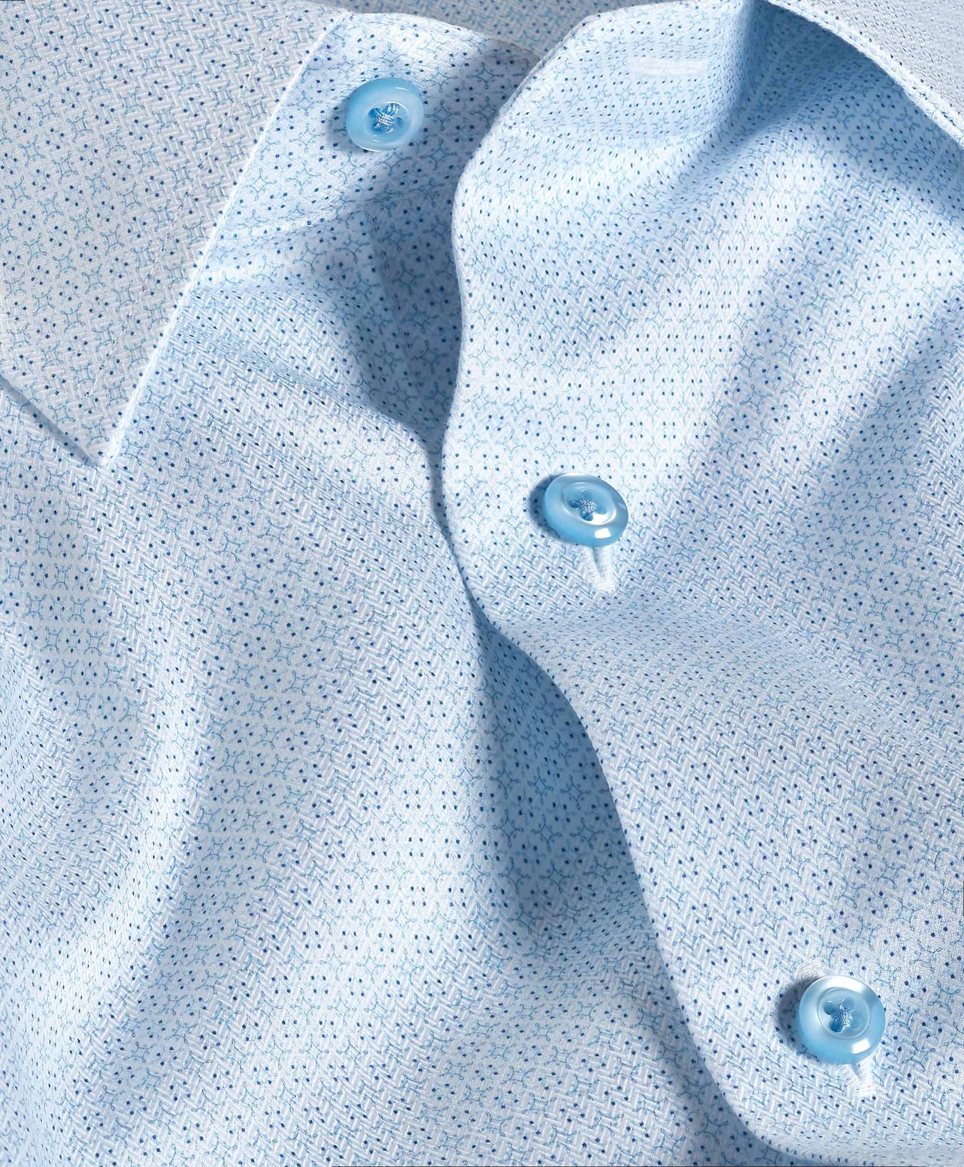 Close-up of the David Donahue OP Geo Dress Shirt TBSP12601136 in light blue, showcasing a small geometric dot pattern and blue buttons.