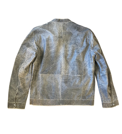 The Missani Leather Jacket 96563 by Missani is a gray, textured motocross-inspired jacket with long sleeves, a flat collar, and visible seam lines, shown from the back.