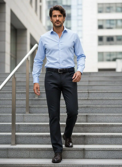 A man in a light blue dress shirt, Alberto Pipe Melange Birdseye Pant 1638 by Alberto, and dress shoes walks down outdoor steps in an urban setting.