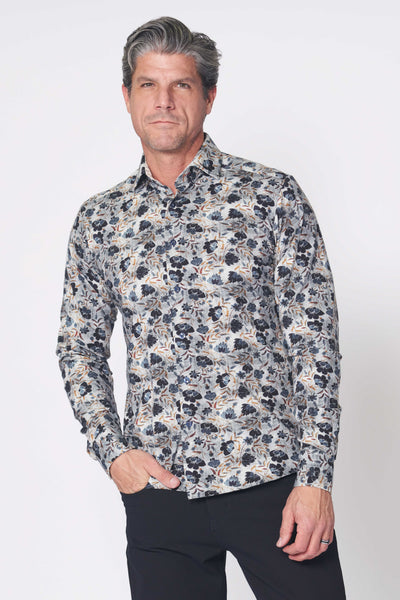 Man wearing the 7 Downie St. Amore Big & Tall Sport Shirt Multi by 7 Downie St, featuring a tailored fit and floral pattern in dark and light blue, standing against a plain white background.