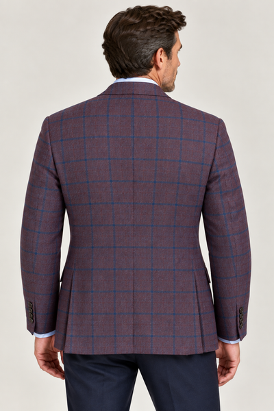 A man shown from the back against a plain light background wears the TailoRed Maroon Navy Windowpane Wool Sport Coat by TailoRed, crafted from fine Italian fabric, paired with navy trousers.