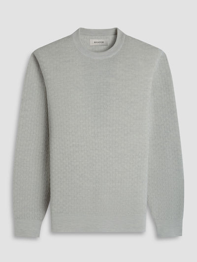 The Bugatchi Basketweave Crew Neck Sweater HH202CN1 is a light gray, long-sleeve Merino wool sweater by Bugatchi, featuring a subtle basketweave pattern, crew neckline, and ribbed cuffs and hem.