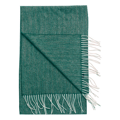 The Amanda Christensen Herringbone Scarf 44017 features a green herringbone pattern with white fringed edges, folded to display both sides, evoking the classic style found in men's accessories.