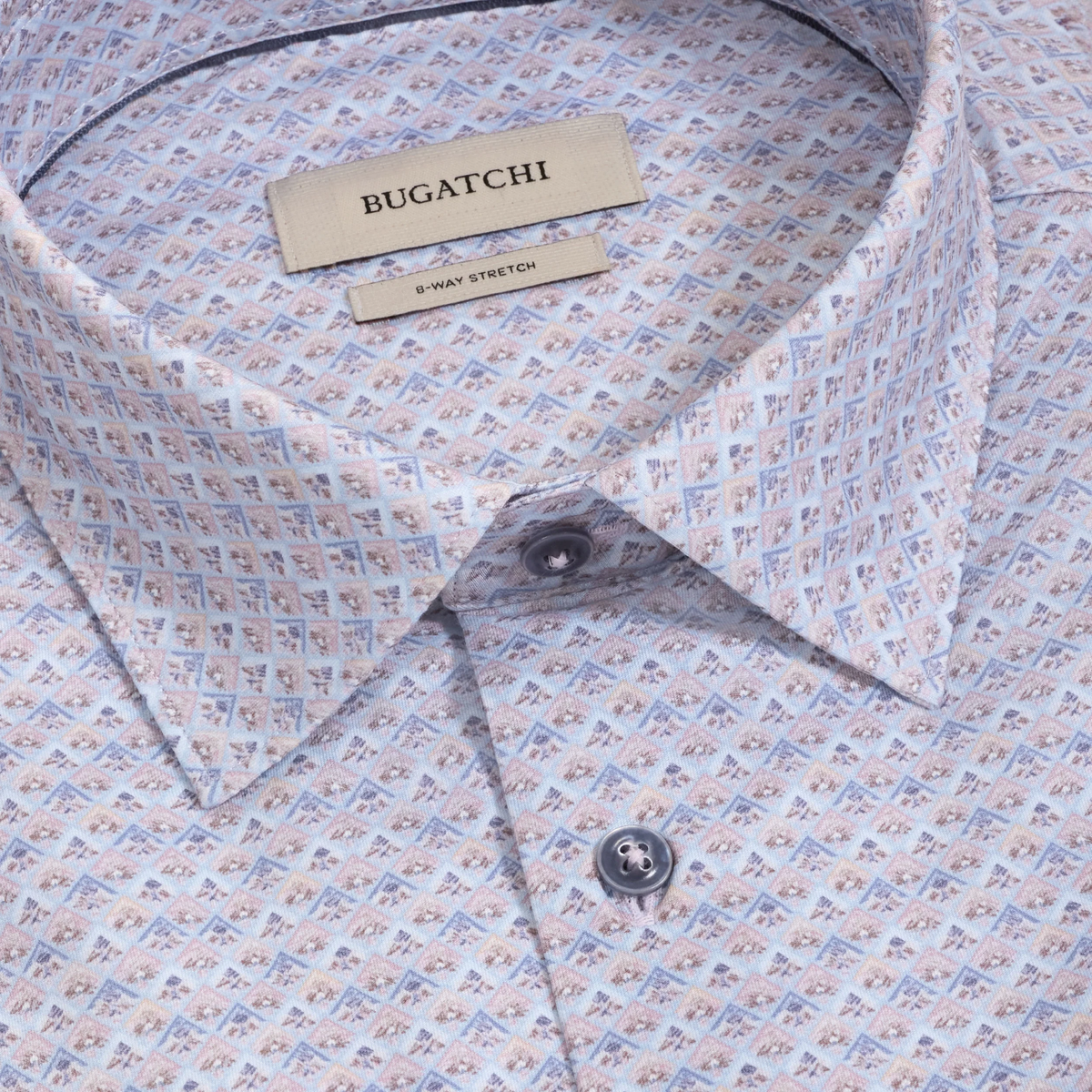 Close-up of the Bugatchi James Medallion Sport Shirt KF9062K60, featuring a geometric medallion pattern in pastel tones and crafted from wrinkle-resistant cotton. The label highlights 8-WAY STRETCH, making this shirt both stylish and exceptionally comfortable.