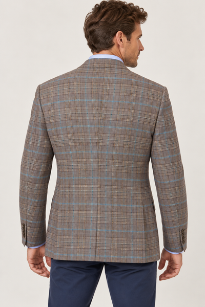Back view of a man wearing a brown plaid Jack Victor Conway Brown Plaid Sport Coat 1262312 with blue windowpane accents over a light blue dress shirt and navy trousers.