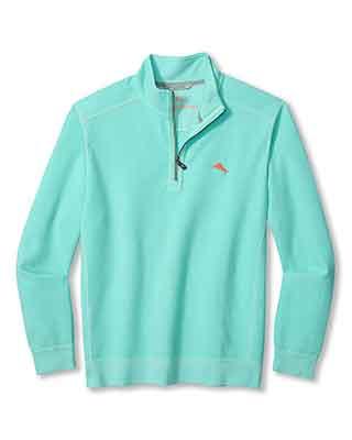 This Tommy Bahama Montego Beach 1/2 Zip is a light turquoise lightweight knit pullover with long sleeves and a small orange embroidered chest logo.