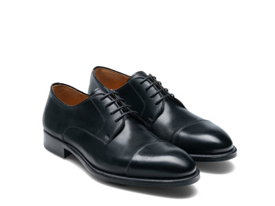 The Magnanni Harlan by Magnanni: a pair of black leather cap toe Oxford dress shoes with laces, side by side on a white background—ideal for giving any outfit a smart-casual, elegant touch.