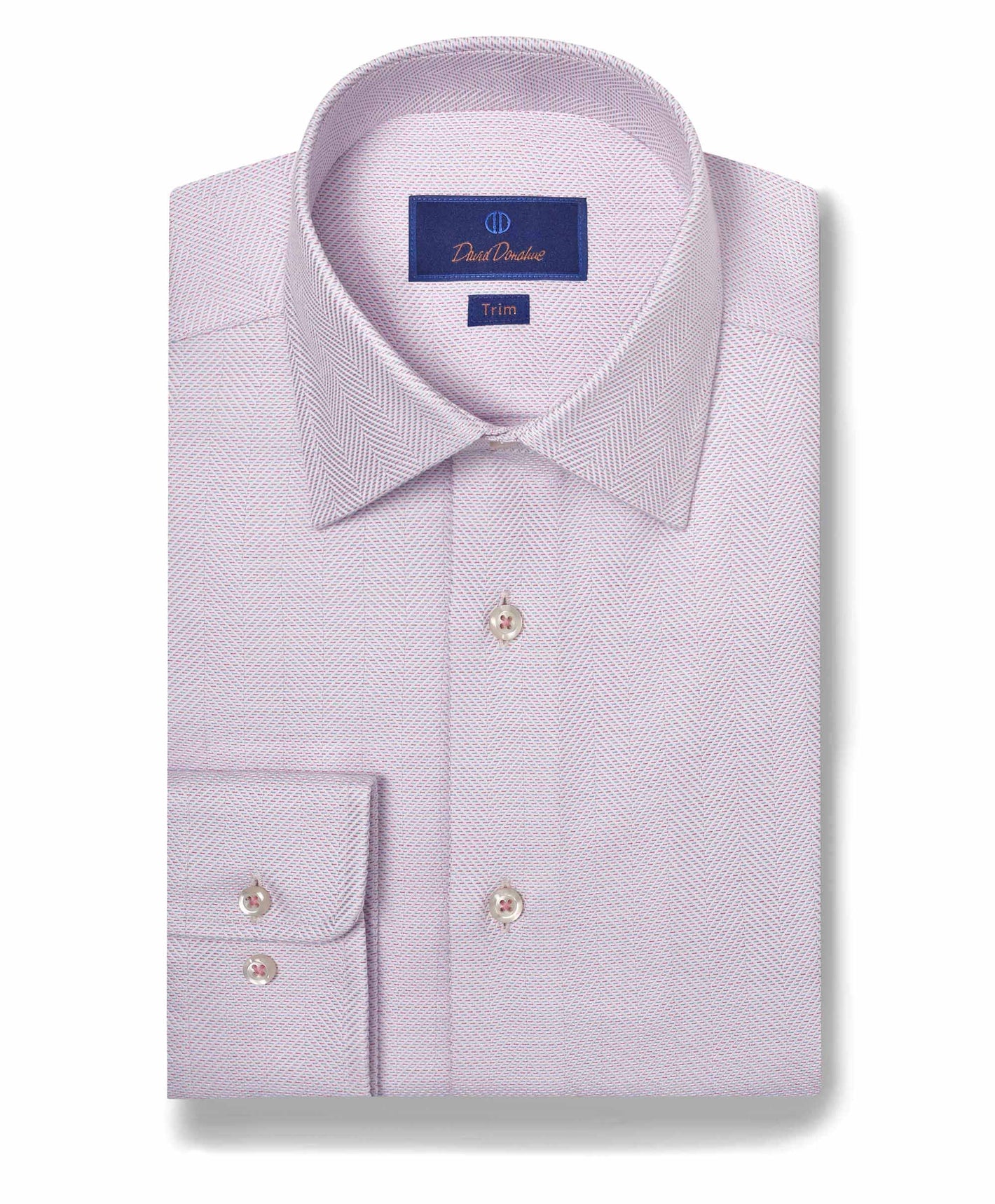 The David Donahue TBSP10013 is a folded light purple Pima cotton dress shirt featuring a herringbone pattern, spread collar, and buttoned cuff, with a Trim label on the inside collar.