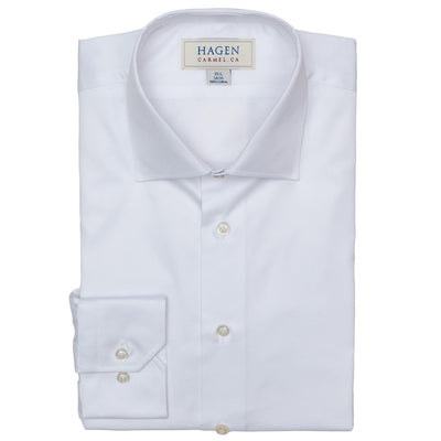 A neatly folded white Hagen Twill Dress Shirt (MB1862100) by Hagen features a label reading “Hagen Carmel, CA” on the inside collar, white buttons, and a classic collar—an essential addition to any formal wardrobe crafted from premium cotton for lasting comfort and style.