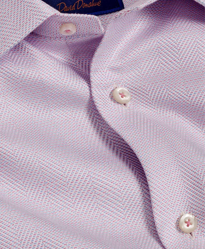 Close-up of the David Donahue TBSP10013 dress shirt by David Donahue in light purple herringbone weave, with white buttons, a spread collar, and part of the collar label visible.