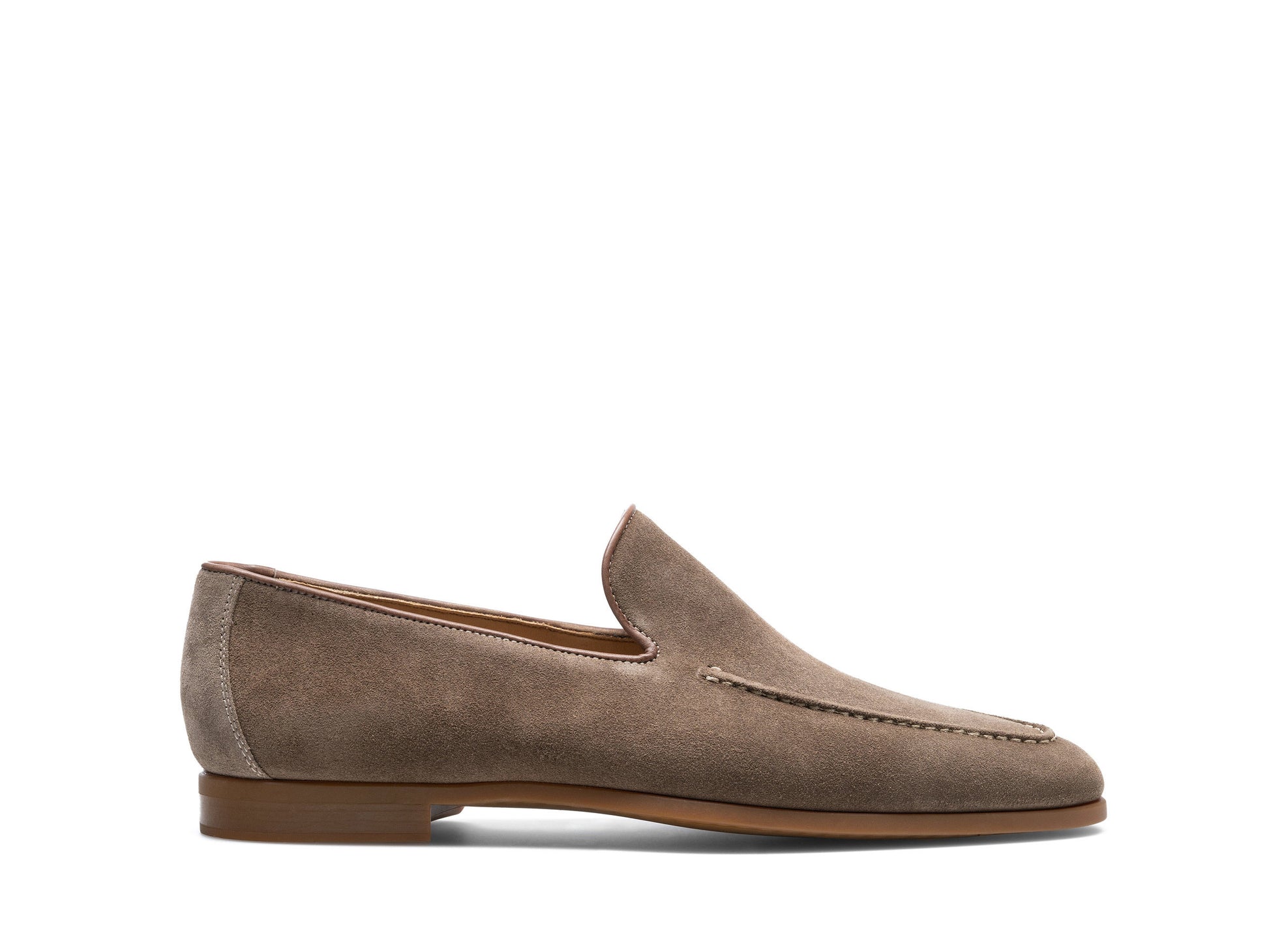 The Magnanni Lecera II Suede Loafer by Magnanni is a brown suede Venetian loafer with a low heel, visible stitching, and a rounded toe. It features a lightweight rubber sole and is shown in side profile against a white background.