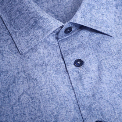 Close-up of the Bugatchi Julian Paisley Sport Shirt HS3069L3S: a light blue, 100% cotton shirt with a paisley print, dark blue buttons, and long sleeves for a classic, stylish look from Bugatchi.