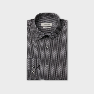 A folded long-sleeve geometric print shirt, the Bugatchi James Chevron Sport Shirt KF9008K60, features a black and white chevron pattern, buttoned cuffs, a visible collar label reading Bugatchi, and wrinkle-resistant fabric that combines classic style with easy-care convenience.