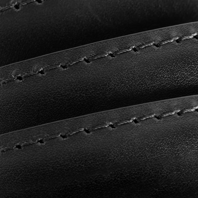 Close-up of black Italian calfskin leather on the Allen Edmonds Wide Basic Belt, with visible parallel curved stitching that highlights the rich texture and expert craftsmanship of this finely handcrafted-in-America dress belt by Allen Edmonds.