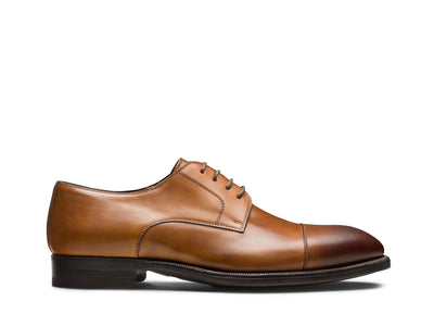 The Magnanni Harlan by Magnanni is a brown leather men's derby shoe with a dark brown cap toe, lace-up closure, and black sole—ideal for smart-casual looks—shown in side profile on a white background.