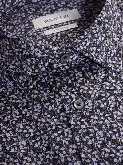 Close-up of the Bugatchi James Leaf Print Sport Shirt HF9221K60 for men, showcasing a blue and white leaf design. This breathable shirt features buttons and part of the collar for a polished, stylish look.