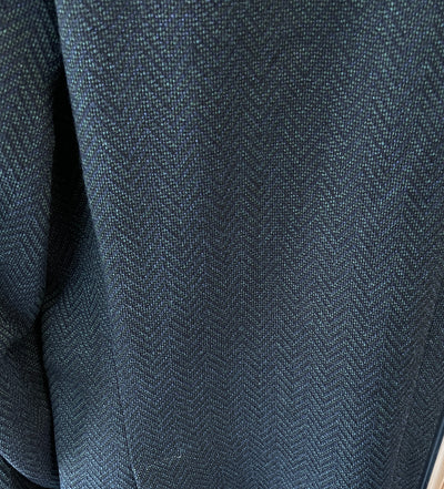 Close-up of dark Italian wool from the Jack Victor Sport Coat C01252—featuring a subtle herringbone pattern and fine diagonal lines, ideal for sophisticated style.