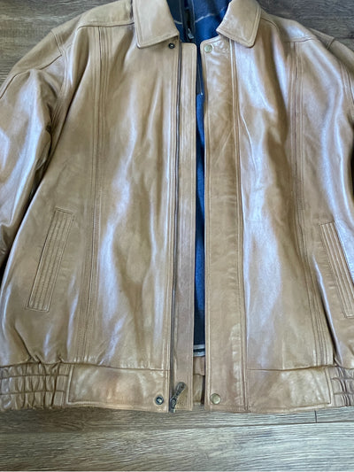 The Scully Lambskin Leather Jacket 978 by Scully, designed for big and tall sizes, features a zip front and side pockets. It is shown laid flat on a wooden surface.
