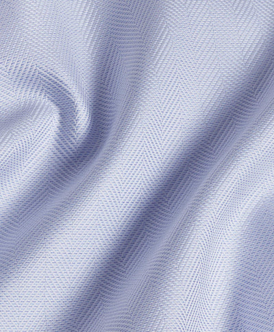 Close-up of David Donahue TBSP10013 dress shirt fabric in light blue Pima cotton, featuring a subtle herringbone weave and gentle folds.