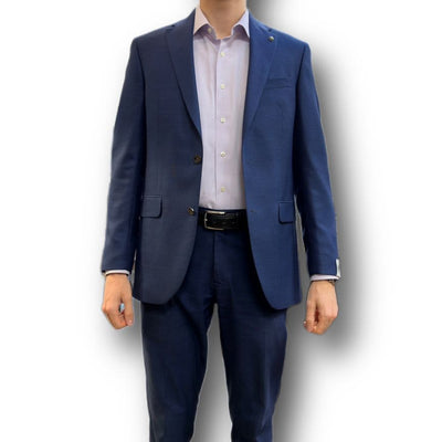 A person wears a Jack Victor Sport Coat 161150 Big and Tall over a white dress shirt with a black belt, standing against a white background.
