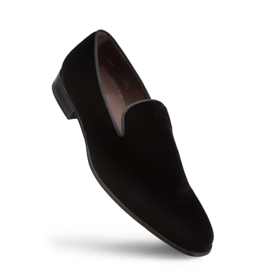 The Mezlan Lublin Velvet Loafer by Mezlan is a black formal slip-on with an almond toe, low heel, and smooth velvet finish, shown against a white background.