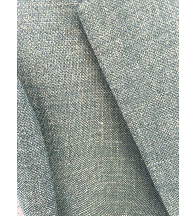 Close-up of textured greenish-blue fabric, similar to the material of the Baroni MaxDavoli 208/36 Sport Coat, covering adjoining cushions or furniture surfaces.