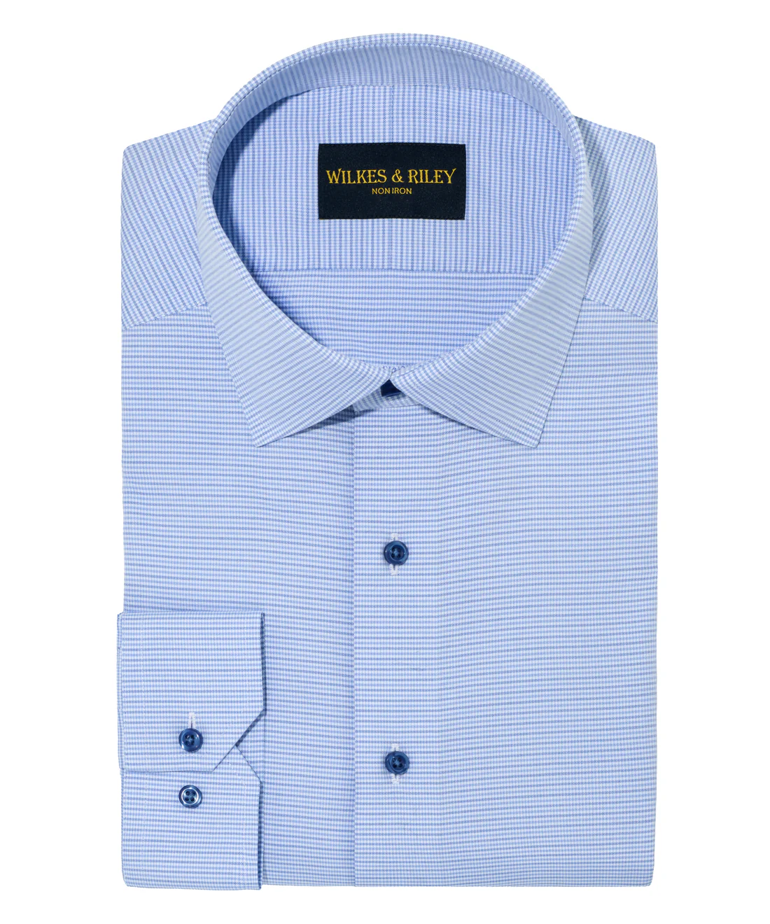 A neatly folded Wilkes & Riley Blue Stripe Spread Collar F4139 dress shirt with a subtle pattern and the brand’s label inside the collar.