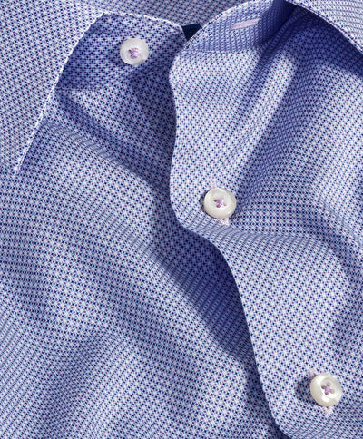 Close-up of the David Donahue Medallion Prt Shirt TBSP11009, a light blue Pima cotton dress shirt with a micro geometric print and white buttons. Slight wrinkles and part of the collar are visible.