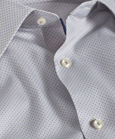 Close-up of the David Donahue Geometric Dot Print Dress Shirt 10010 in light blue 100% cotton with white buttons, partially unbuttoned to display its fine geometric pattern—a refined choice for formal events.
