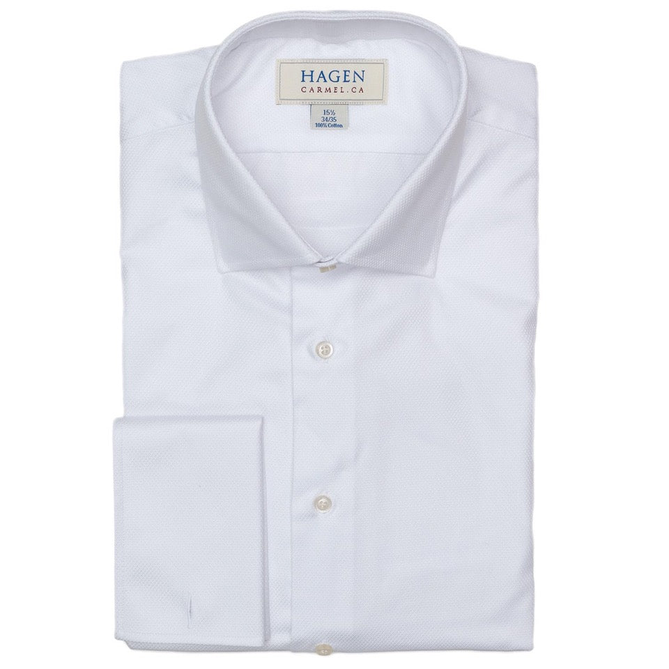 The Hagen Dobby Tux Shirt MF12706100 is a white, premium cotton dress shirt with a spread collar and button front, featuring the Hagen label on the inside collar.