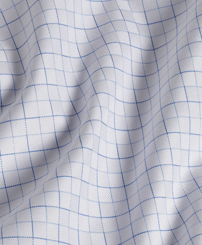 Close-up of the David Donahue White & Blue Open Check Dress Shirt 10811 fabric, featuring soft white Pima cotton with a blue check grid and gentle folds.