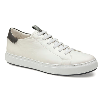 The Johnston & Murphy Anson is a white low-top sneaker by Johnston Murphy, made from full grain leather with white laces, a gray pull tab, dark gray heel accent, and a cushioned EVA outsole for comfort. Shown on a white background.