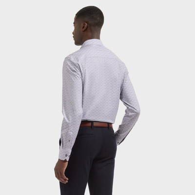 A person stands facing away, wearing the Bugatchi James Medallion Sport Shirt (KF9062K60), paired with dark dress pants and a brown belt, against a plain light background.