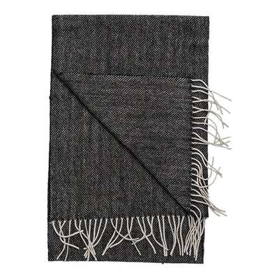 The Amanda Christensen Herringbone Scarf 44017 features a folded black and white wool herringbone pattern with white fringe, displayed on a plain background—a classic men’s accessory from Amanda Christensen.