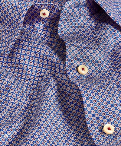 Close-up of the David Donahue Tile Print Shirt (CHBD11208), showcasing a blue geometric pattern with small circles and cream buttons with red thread, in a modern trim fit.