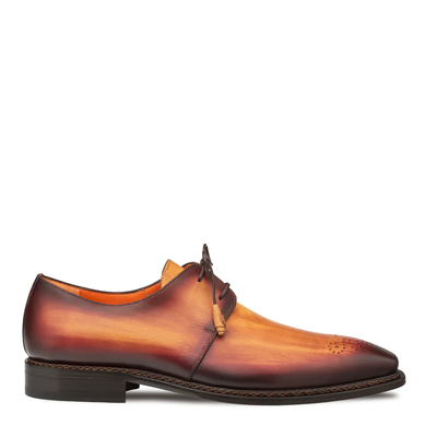 The Mezlan Principe Patina Leather Derby 20842 is a men's lace-up shoe featuring a brown-to-tan gradient Italian calfskin, low heel, and toe perforations. Handmade in Spain by Mezlan for timeless elegance.