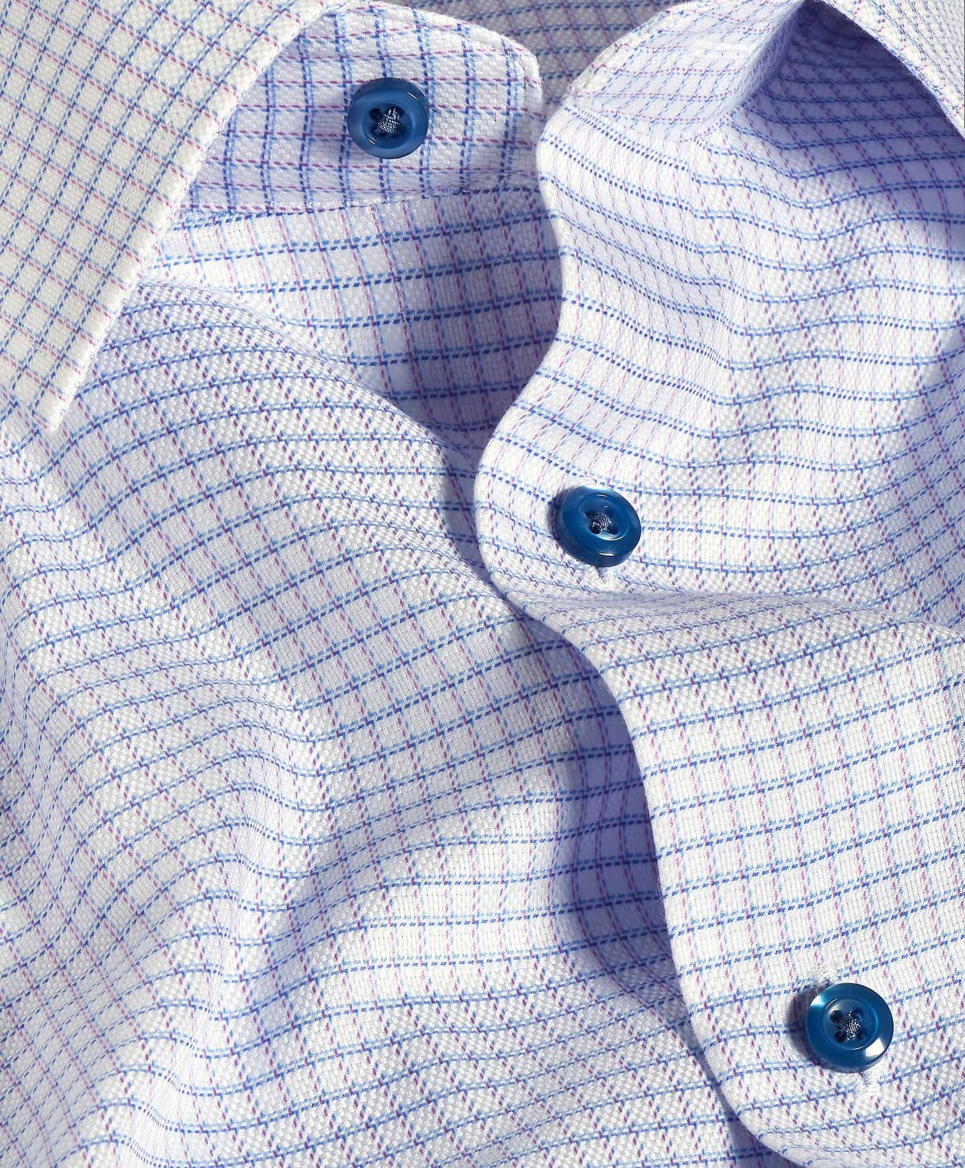 Close-up of the David Donahue OP Check Dress Shirt TBSP12821144, featuring a blue and purple checkered pattern and blue buttons—an elegant update from David Donahue to the classic stripe dress shirt.