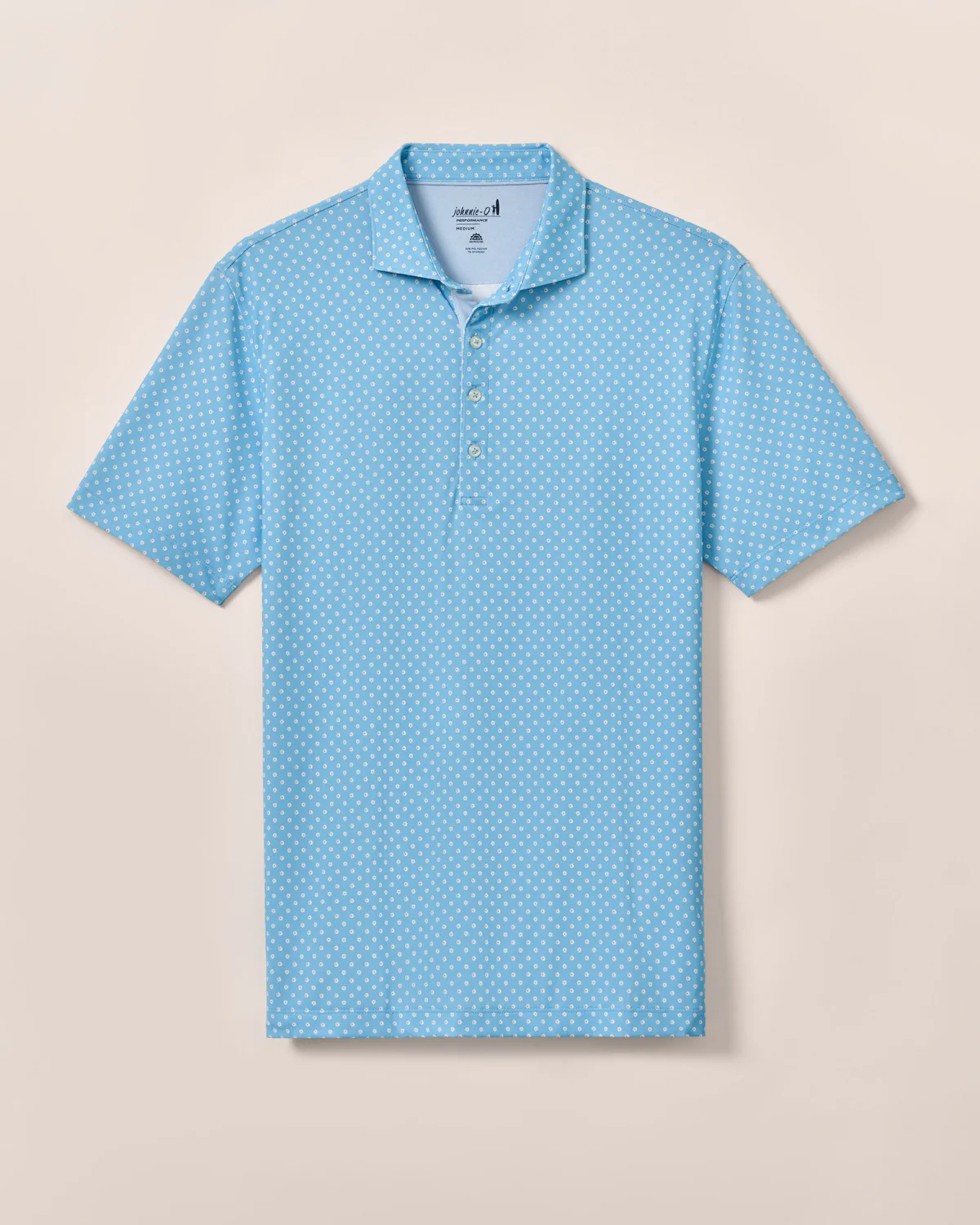 The Johnnie-O Daisy Performance Short Sleeve Polo features a light blue color with a white polka dot pattern, button-up collar, and moisture-wicking fabric for stylish comfort on any occasion.