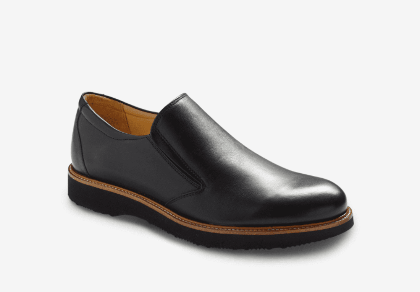 The Samuel Hubbard Frequent Traveler Black 10 is a black leather slip-on with a round toe, tan lining, memory foam insole, and a black sole accented with brown trim.
