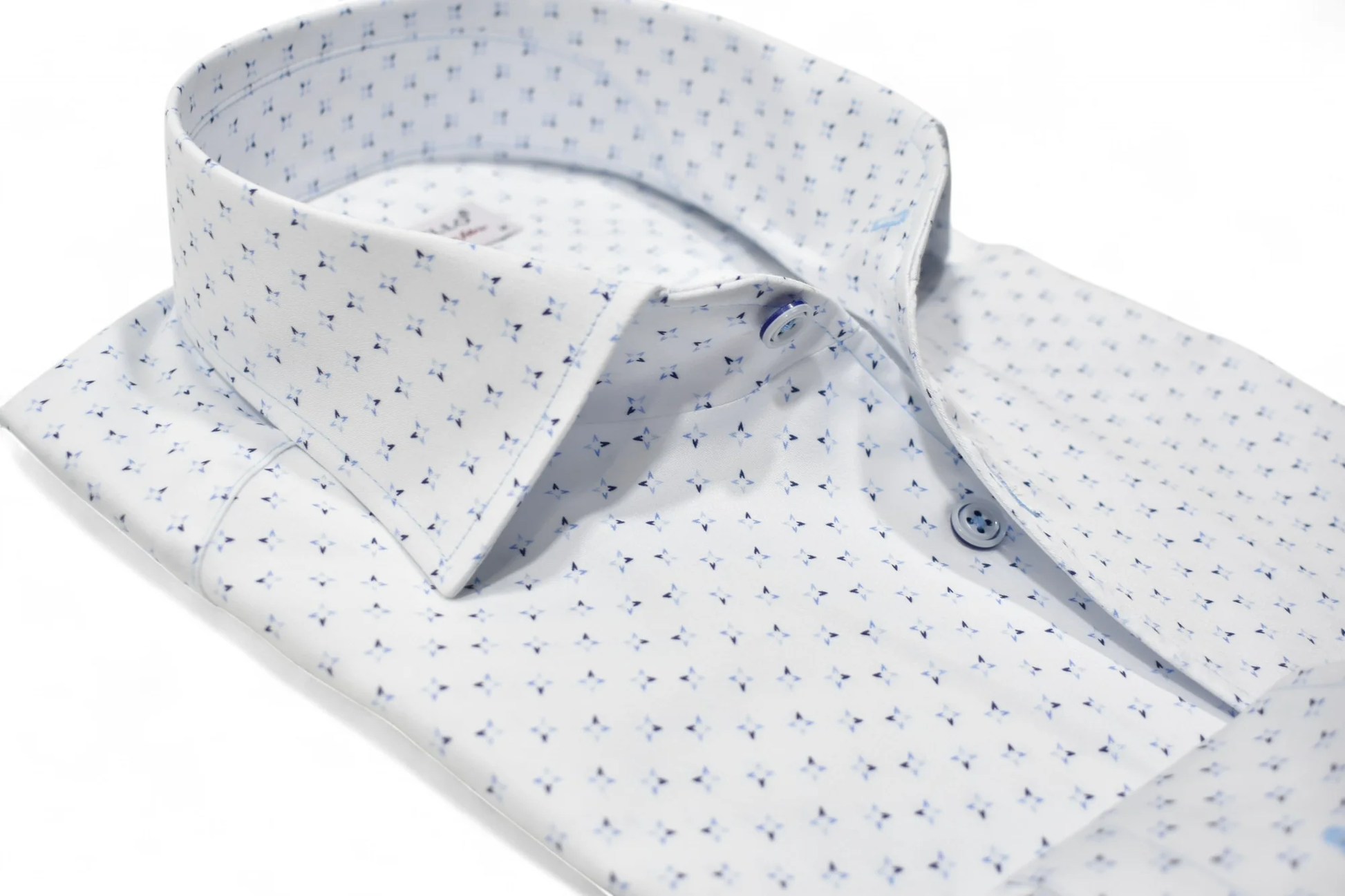 The Marcello OP Star Medallion Sport Shirt W114 by Marcello is a classic fit white cotton sateen shirt, detailed with a small blue geometric pattern and blue buttons, shown neatly folded on a plain white background.