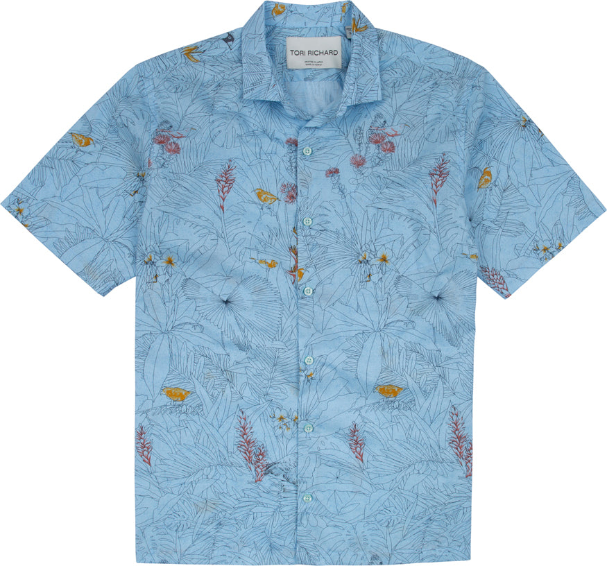 The Tori Richard Printed Cotton Manu Garden Shirt 1956M0354 is a light blue, short-sleeve button-up featuring a subtle botanical and fish print.