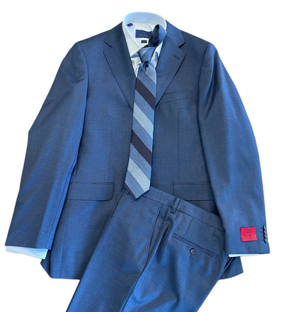 The Byron Contemporary Luxe Suit 3708 by Byron, shown with matching trousers, a white dress shirt, and blue striped tie in fine Italian wool, is displayed flat with a red label on the jacket sleeve.