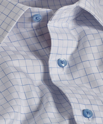 Close-up of the David Donahue White & Blue Open Check Dress Shirt 10811, featuring a blue checkered pattern, blue buttons, French placket, spread collar, and visible fabric folds.